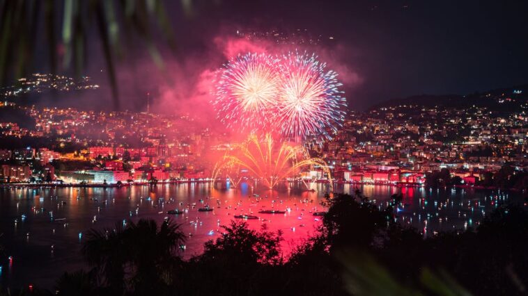 A winter scene at Niagara Falls Winter Festival of Lights, with illuminated trees and glowing light displays creating a magical atmosphere.