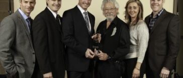 David Suzuki presenting sustainability award to Skyline REIT at the 2025 FRPO Awards
