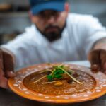 Butter Chicken served at Dhaba on the Falls in Niagara Falls, Ontario – a rich North Indian curry in a creamy tomato sauce.