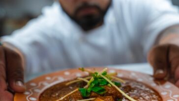 Butter Chicken served at Dhaba on the Falls in Niagara Falls, Ontario – a rich North Indian curry in a creamy tomato sauce.
