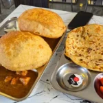 nterior view of DelhiJunction Indian restaurant in Niagara Falls, featuring cozy seating and Indian-inspired decor