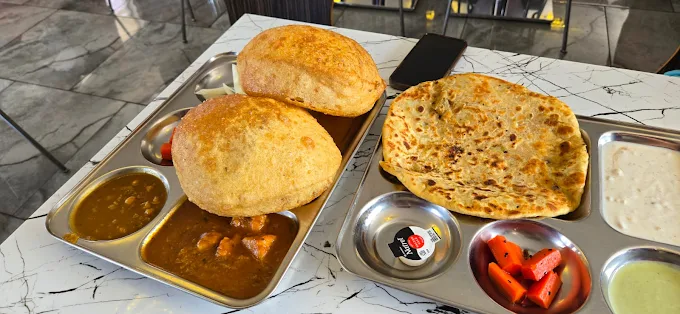 nterior view of DelhiJunction Indian restaurant in Niagara Falls, featuring cozy seating and Indian-inspired decor