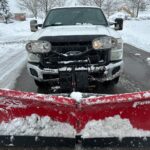 Snow-covered driveway being professionally cleared by NLLC team in Niagara Falls, Canada