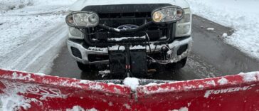 Snow-covered driveway being professionally cleared by NLLC team in Niagara Falls, Canada