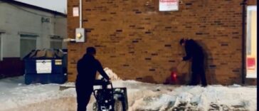 NLLC team clearing snow from a Domino’s Niagara driveway to ensure safe access for customers and deliveries.