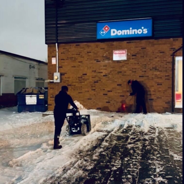 NLLC team clearing snow from a Domino’s Niagara driveway to ensure safe access for customers and deliveries.