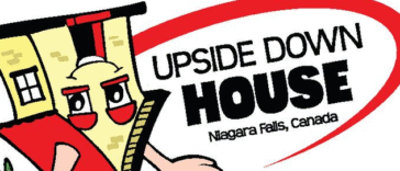 Inside view of The Upside Down House Niagara Falls showing inverted furniture and illusion rooms on Clifton Hill.