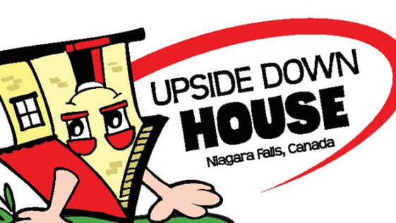 Inside view of The Upside Down House Niagara Falls showing inverted furniture and illusion rooms on Clifton Hill.