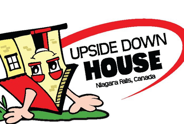 Inside view of The Upside Down House Niagara Falls showing inverted furniture and illusion rooms on Clifton Hill.