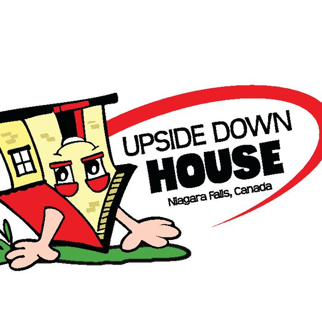 Inside view of The Upside Down House Niagara Falls showing inverted furniture and illusion rooms on Clifton Hill.