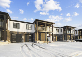 Professional snow removal service clearing a residential driveway in Niagara Falls during winter