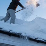 Professional snow removal service clearing a residential driveway in Niagara Falls