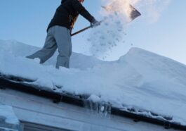 Professional snow removal service clearing a residential driveway in Niagara Falls