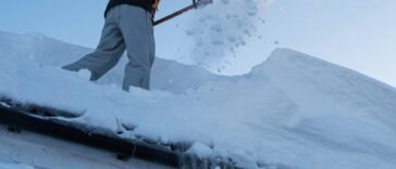 Professional snow removal service clearing a residential driveway in Niagara Falls