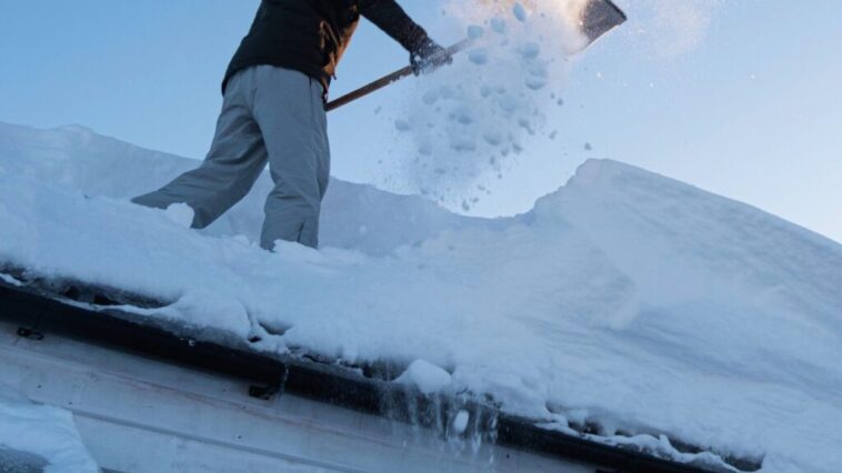 Professional snow removal service clearing a residential driveway in Niagara Falls