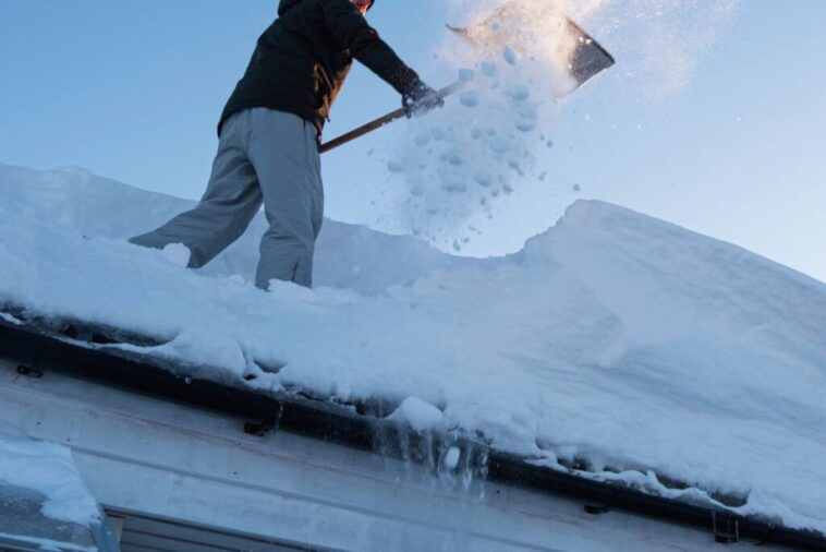 Professional snow removal service clearing a residential driveway in Niagara Falls