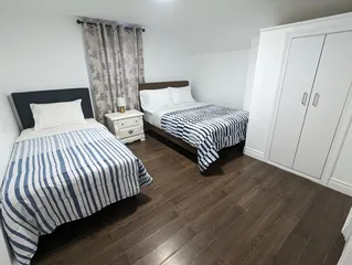 Student apartment living room in Niagara Falls featuring a modern furnished space by The Home Away From Home Developments Inc