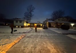 Snow-covered driveway and walkway in Niagara Falls, highlighting the importance of timely snow removal for safety and legal compliance.