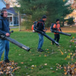 Professional lawn cleanup service in Niagara Falls removing leaves and debris