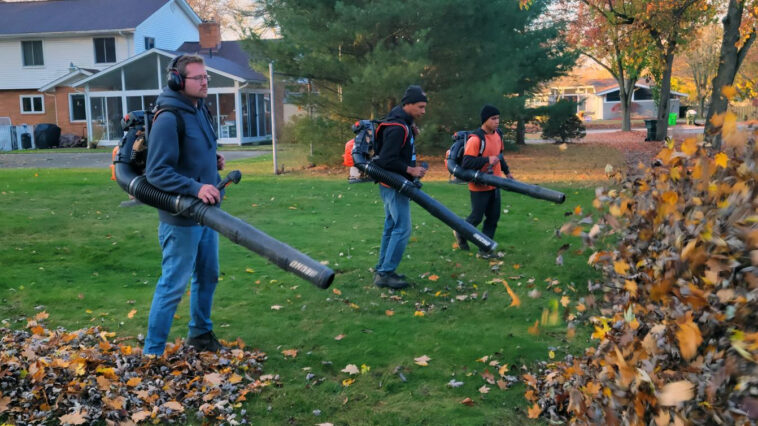 Professional lawn cleanup service in Niagara Falls removing leaves and debris