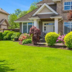 lawn care team mowing a lush green residential lawn in Niagara Falls