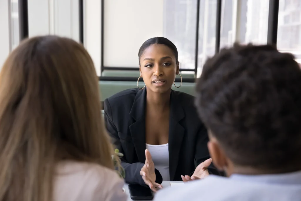 Property manager discussing rental issues with tenant in a calm meeting