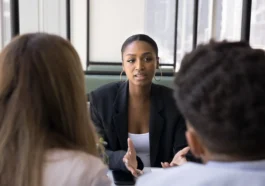 Property manager discussing rental issues with tenant in a calm meeting