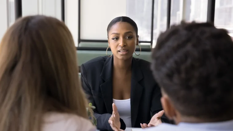 Property manager discussing rental issues with tenant in a calm meeting
